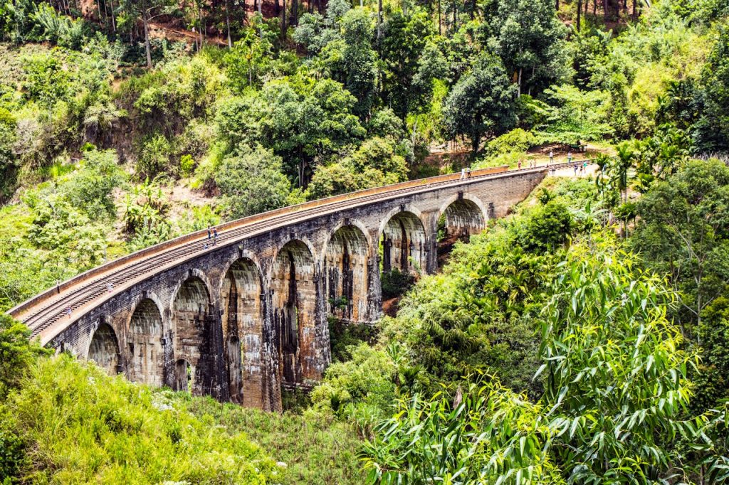 Discover the lush greenery and iconic Nine Arches Bridge in Demodara, Sri Lanka.